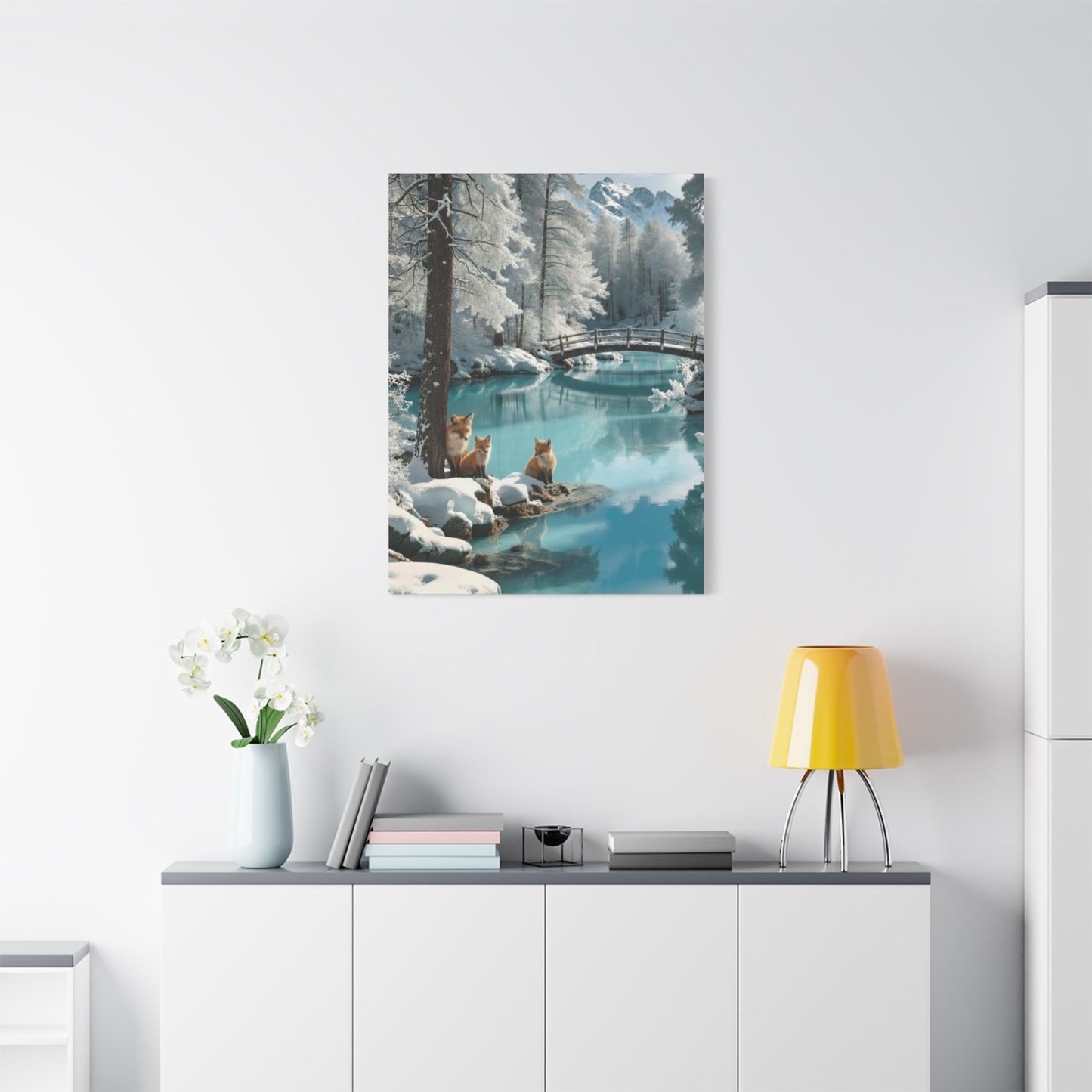 Canvas wall art featuring winter foxes by a serene snow-covered lake with a wooden bridge in the background