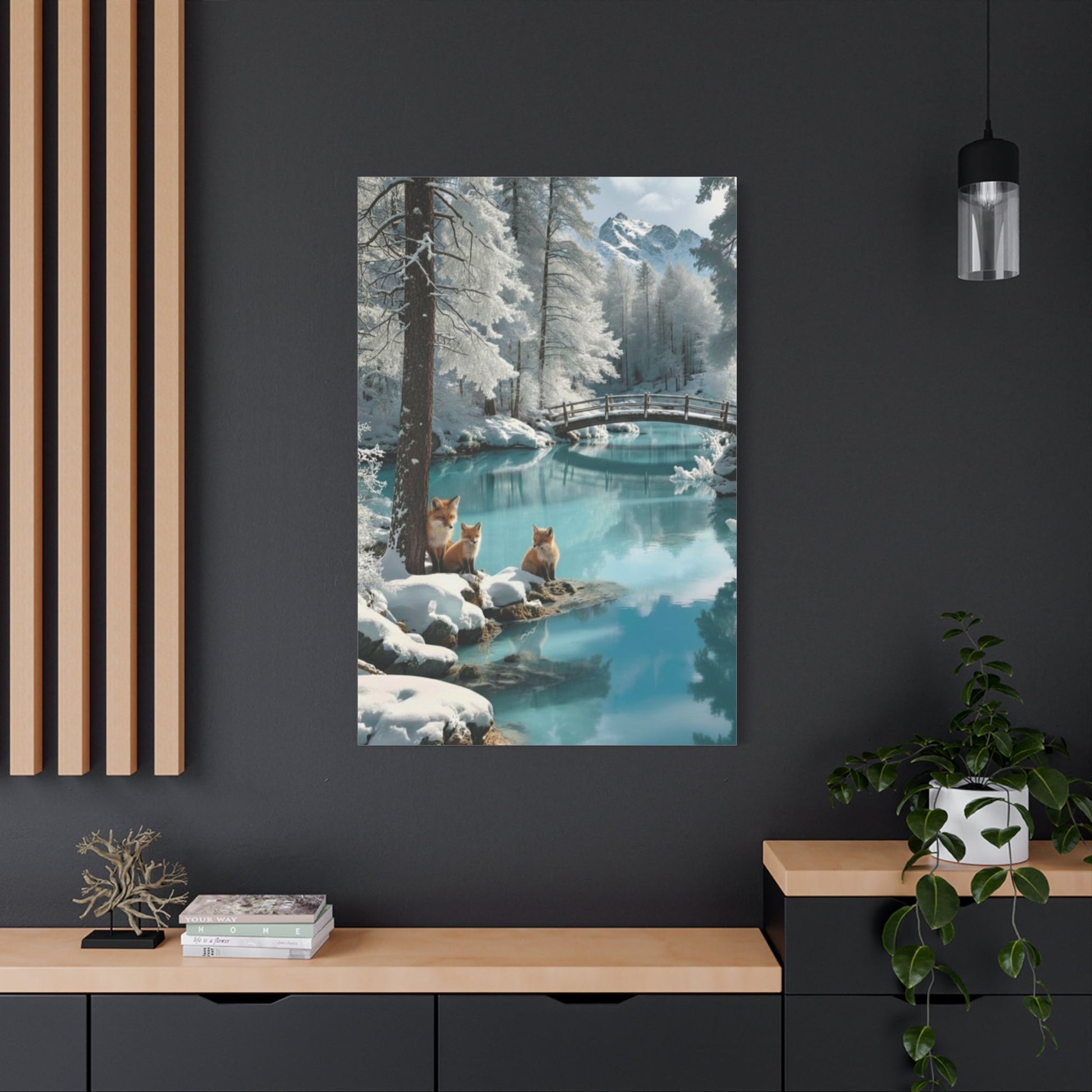 Canvas wall art featuring winter foxes by a snowy riverside with a wooden bridge and pine trees, perfect for cozy home decor.