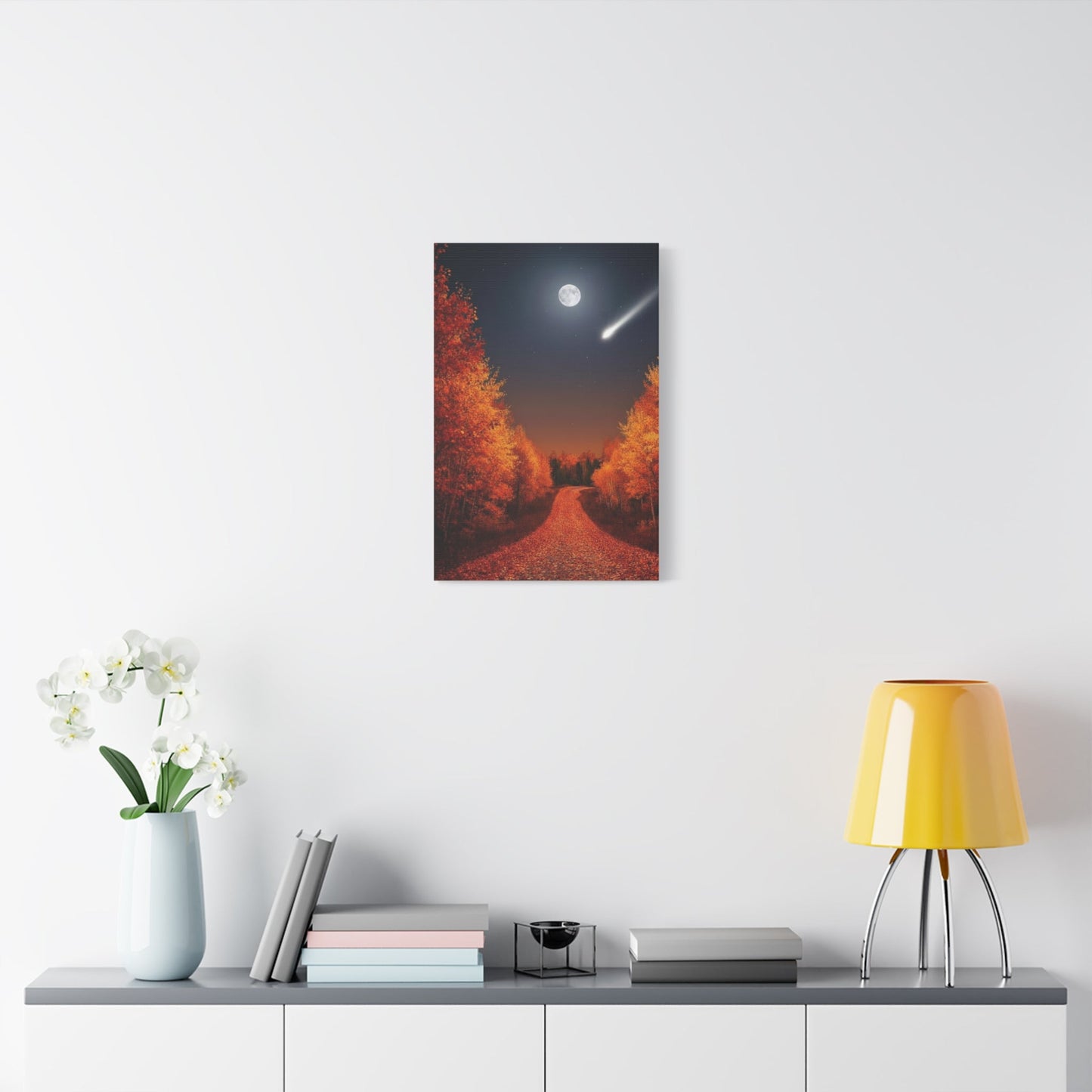 Canvas wall art featuring an autumn forest road under a moonlit sky with a shooting star and warm fall foliage colors.