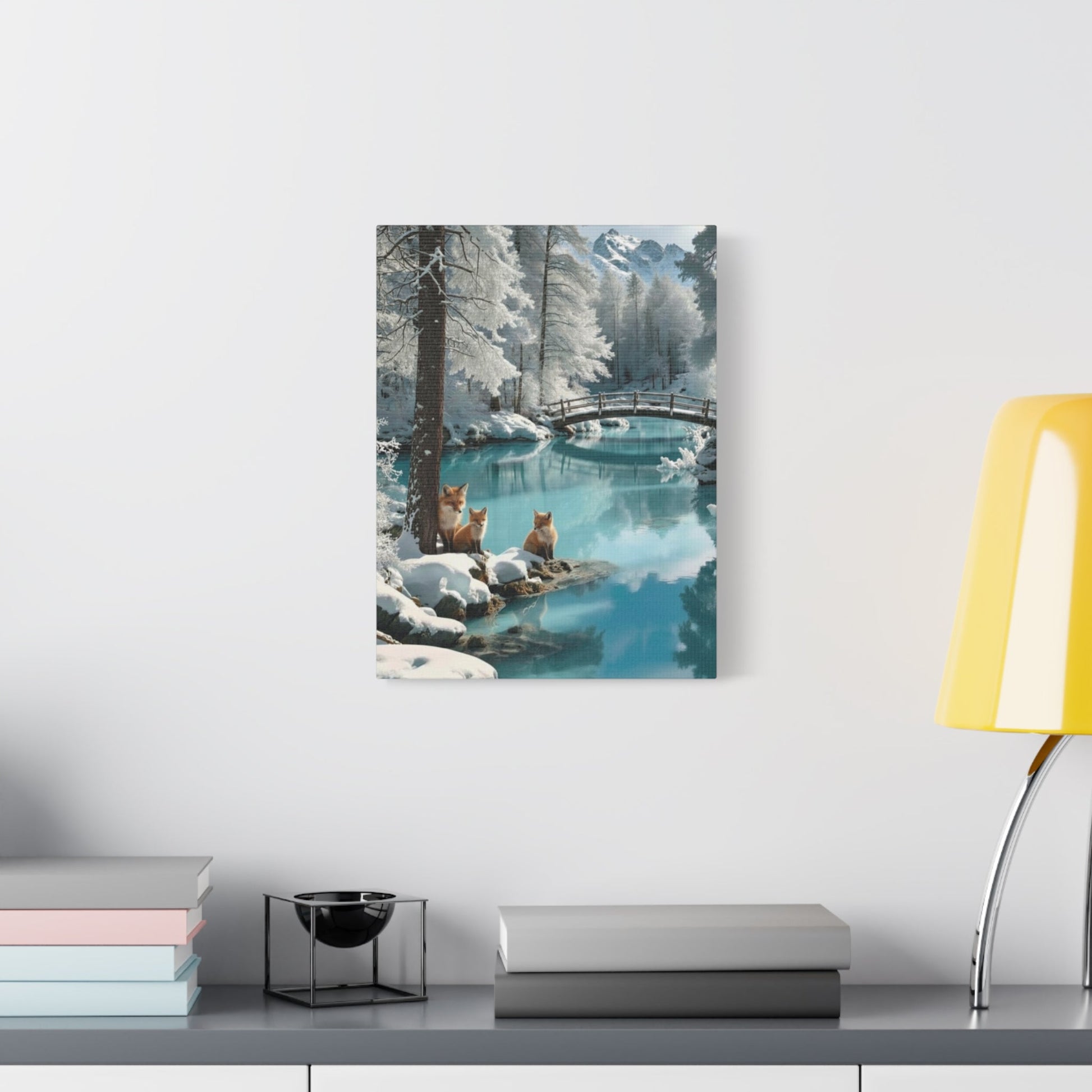 Canvas wall art featuring winter foxes by a snowy river landscape hanging in modern room