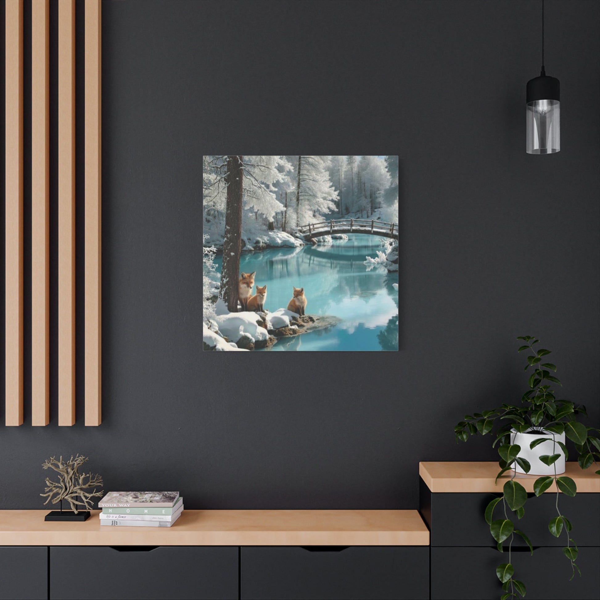 Canvas wall art with winter foxes by serene snowy stream and wooden bridge in cozy modern room