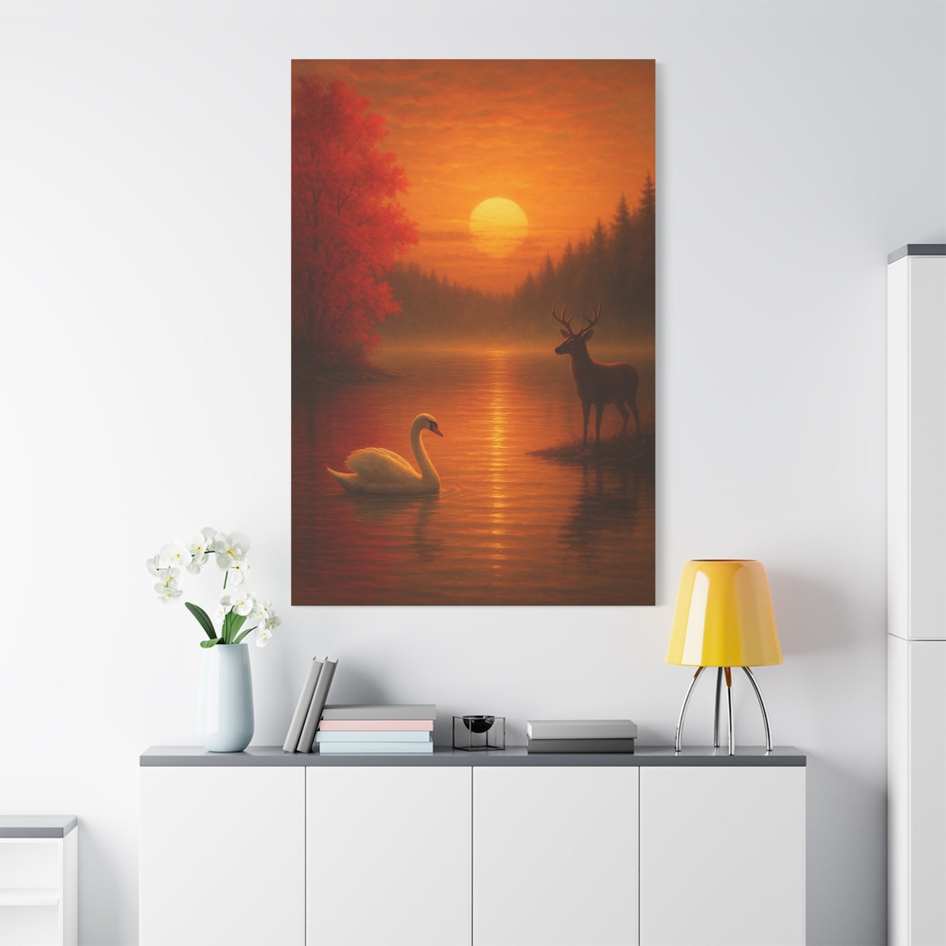 Dusk on the Autumn Lake Sunset canvas wall art featuring a swan and deer by a fiery orange sunset with crimson maple leaves.