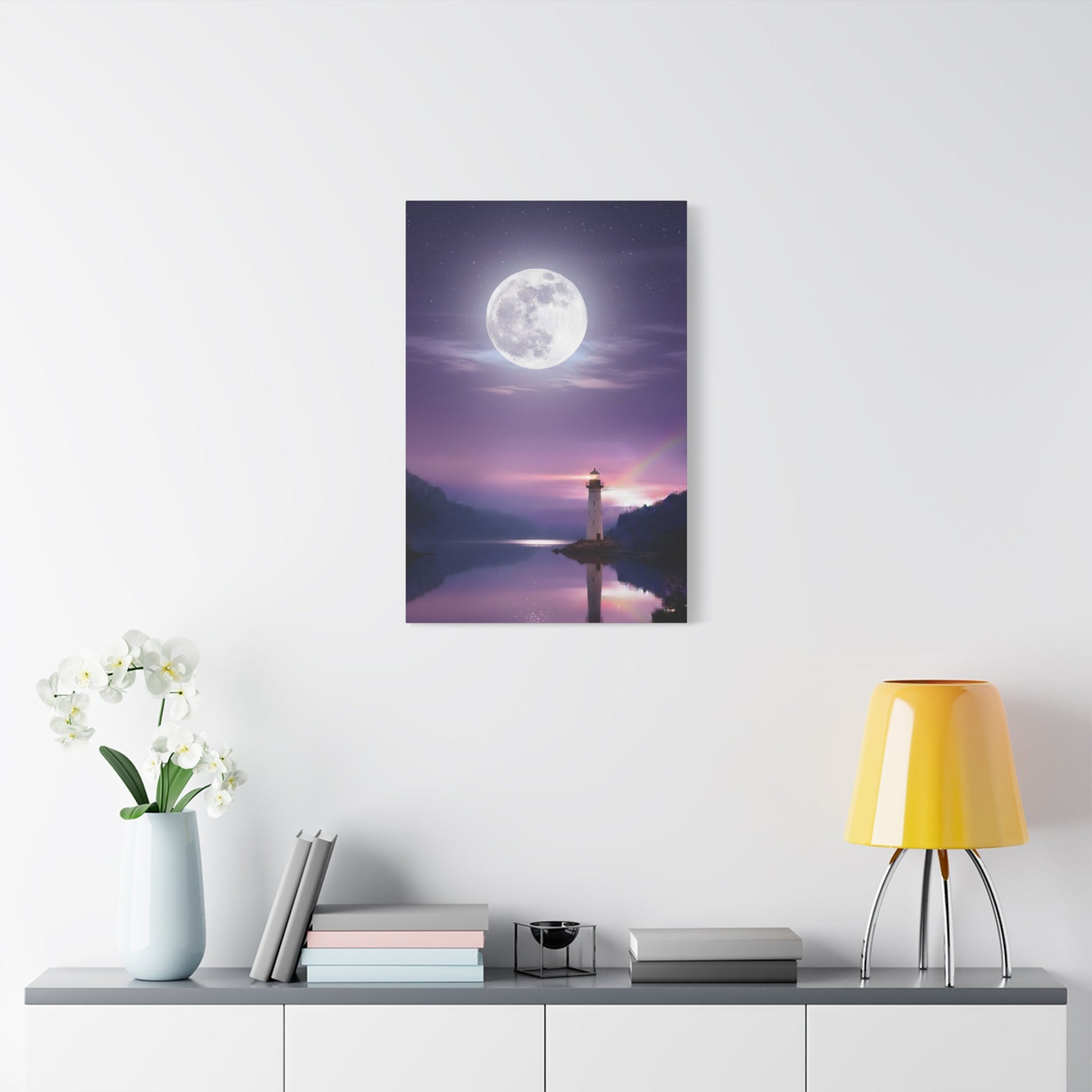 Canvas wall art depicting a serene full moon over a calm lake with a lighthouse reflecting in violet and indigo tones