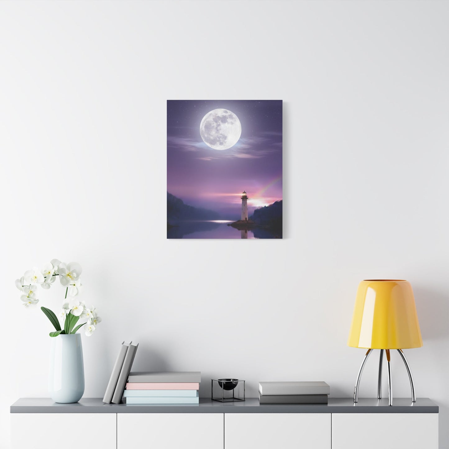 Canvas wall art featuring a full moon over a calm lake with a lighthouse in violet and indigo tones, evoking serene solitude