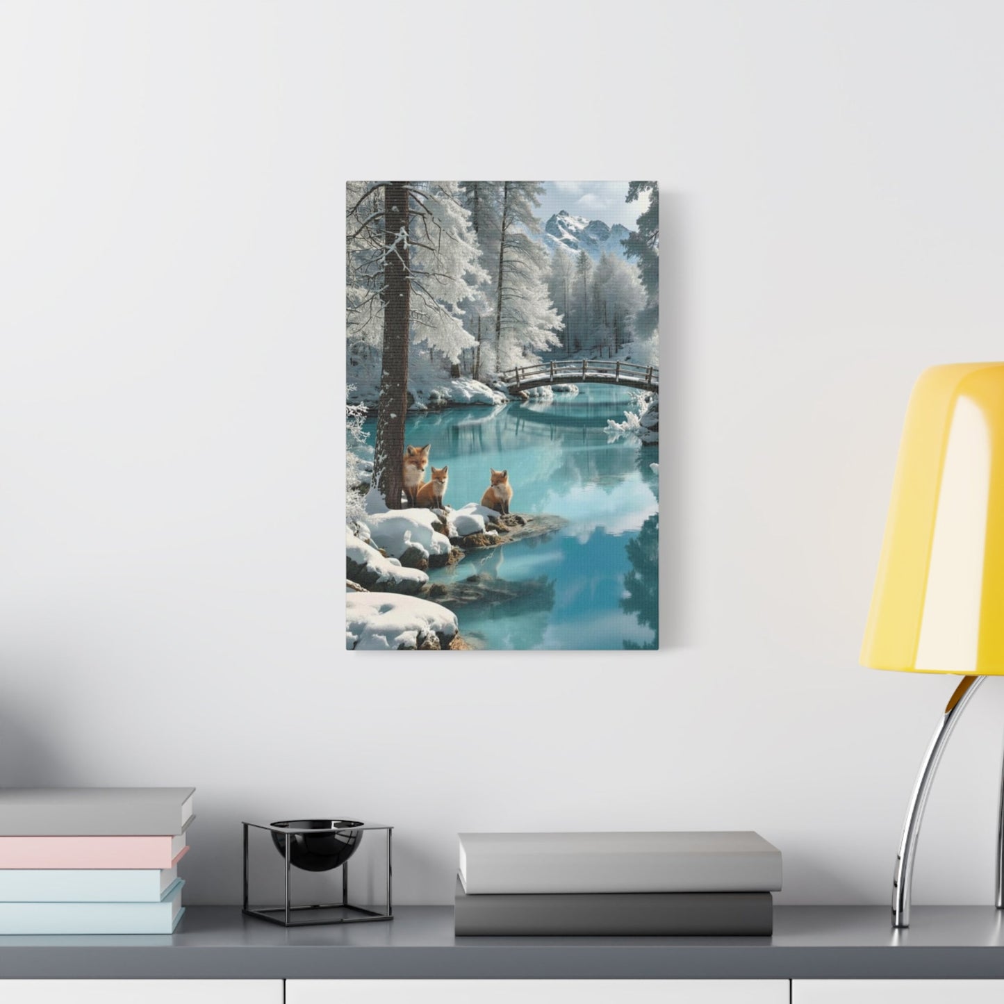 Canvas wall art featuring winter foxes by a serene snowy river with a bridge in the background