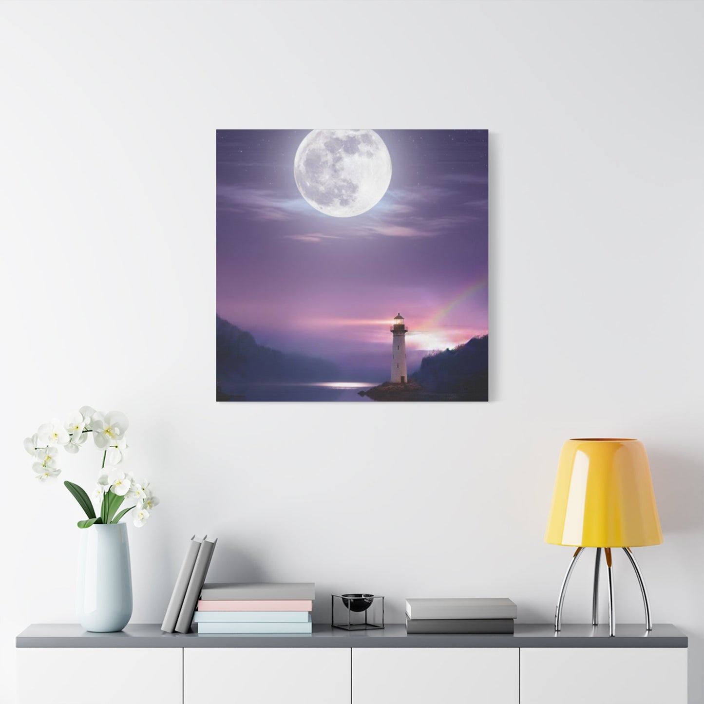 Canvas wall art depicting a full moon over a calm lake with a lighthouse, in serene violet and indigo tones.