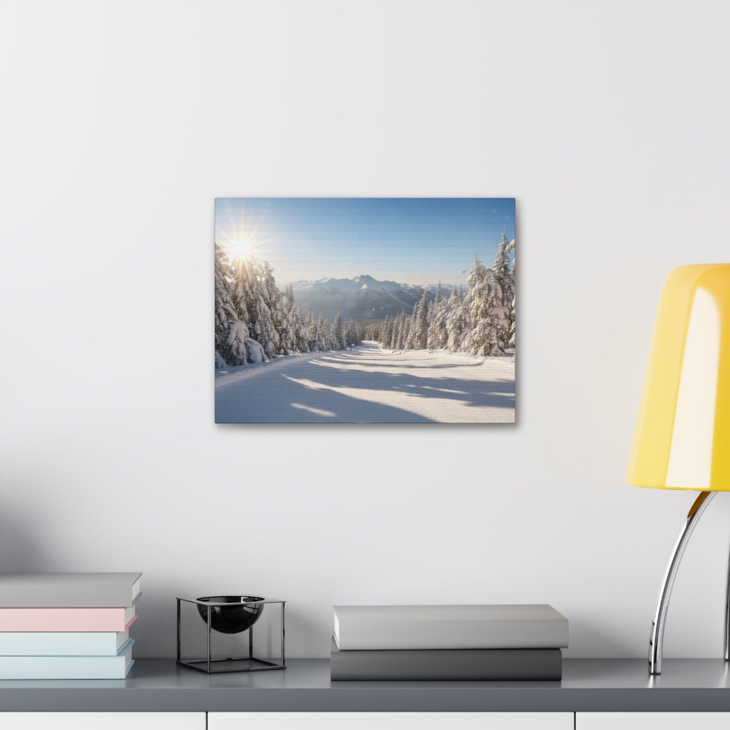 Canvas Wall Art featuring a serene wintry trail with snow-covered trees and mountains under a clear blue sky