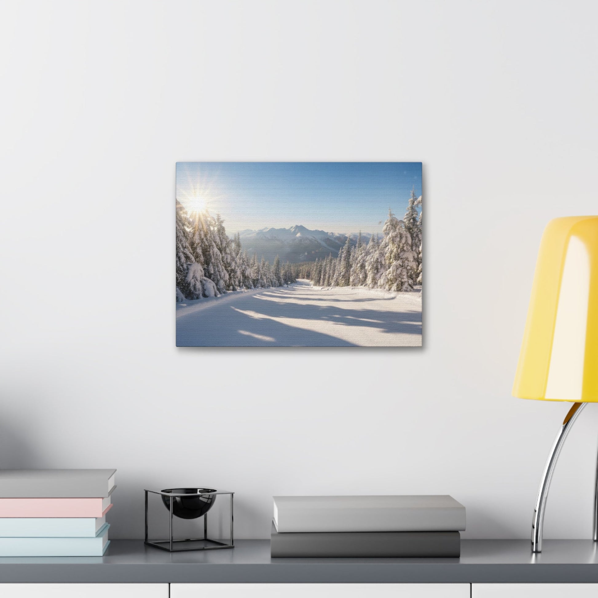 Canvas Wall Art featuring a serene wintry trail with snow-covered trees and mountains under a clear blue sky