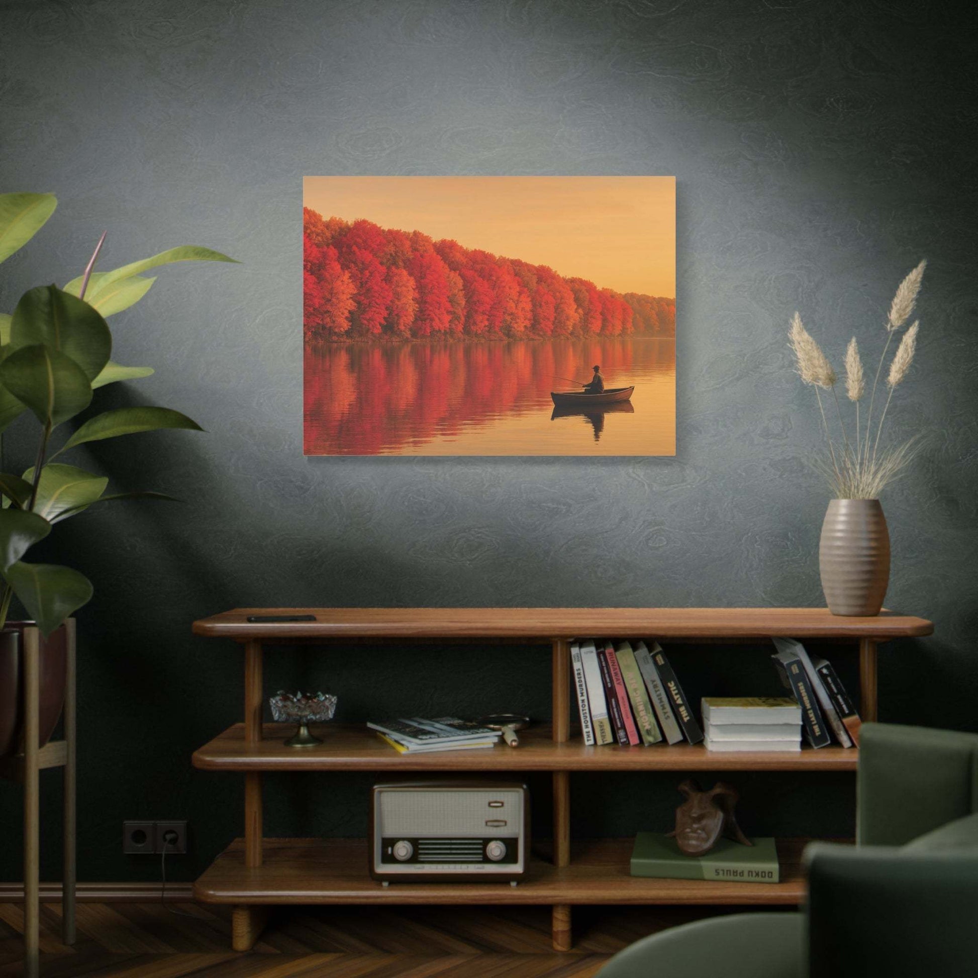 Wall art canvas of autumn foliage with a fisherman on a calm lake hanging above a wooden shelf in a modern living room