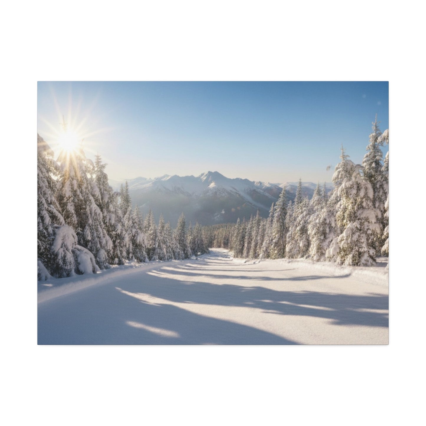 Canvas wall art of a serene winter trail with snow-covered pine trees and mountains under a clear sky
