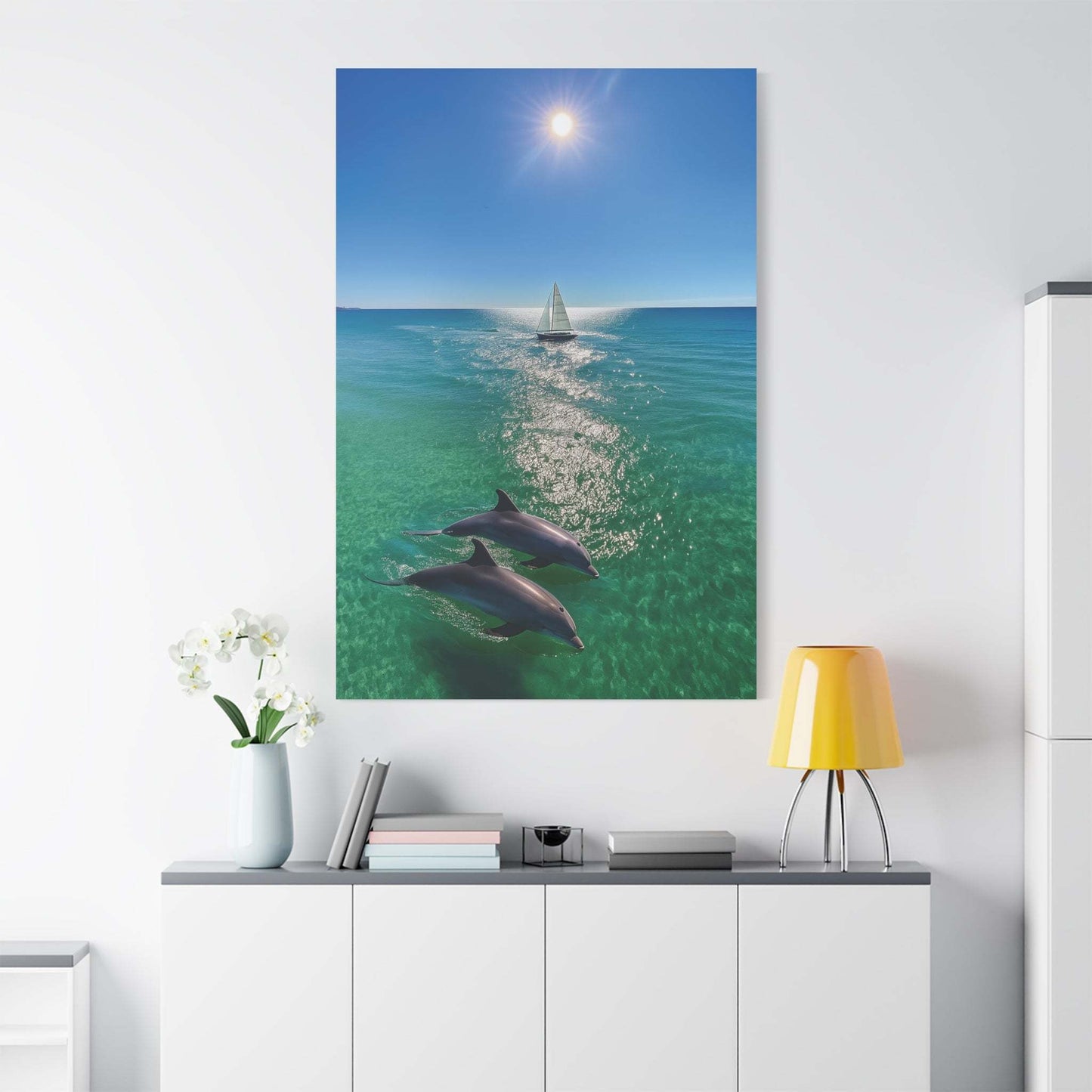 Wall art canvas print featuring ocean scene with sailboat and dolphins under the sun