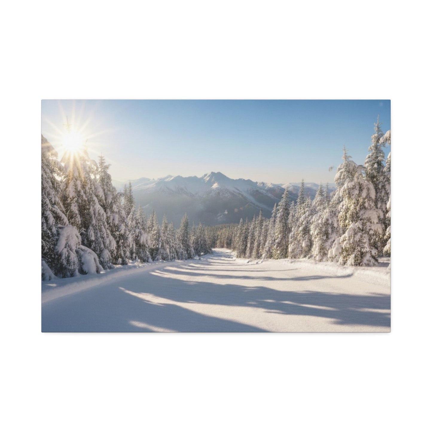 Canvas wall art of a tranquil wintry trail with snow-covered trees and distant mountains under a clear sky