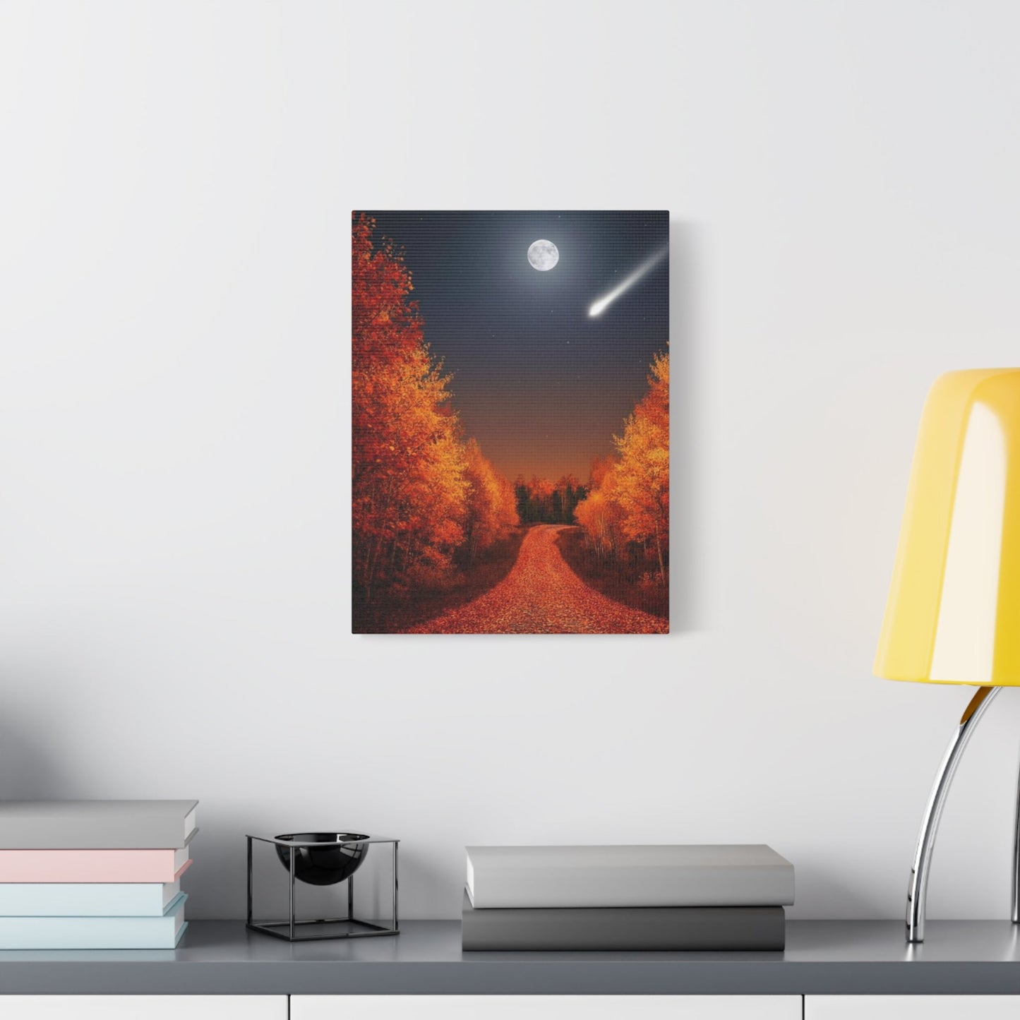 Canvas wall art featuring a moonlit autumn forest road with vibrant orange leaves and a shooting star above