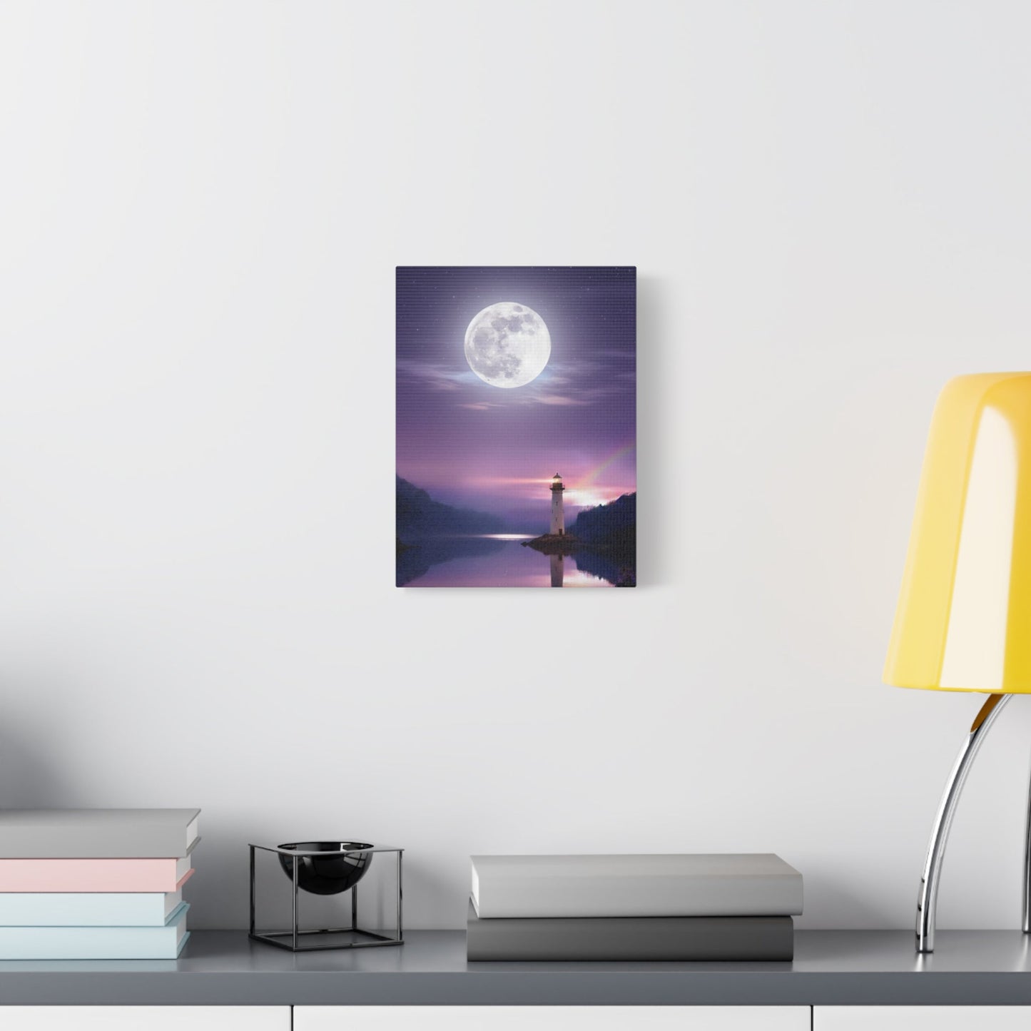 Canvas wall art showing a lighthouse by a mirror-smooth lake under a full moon with violet and indigo tones