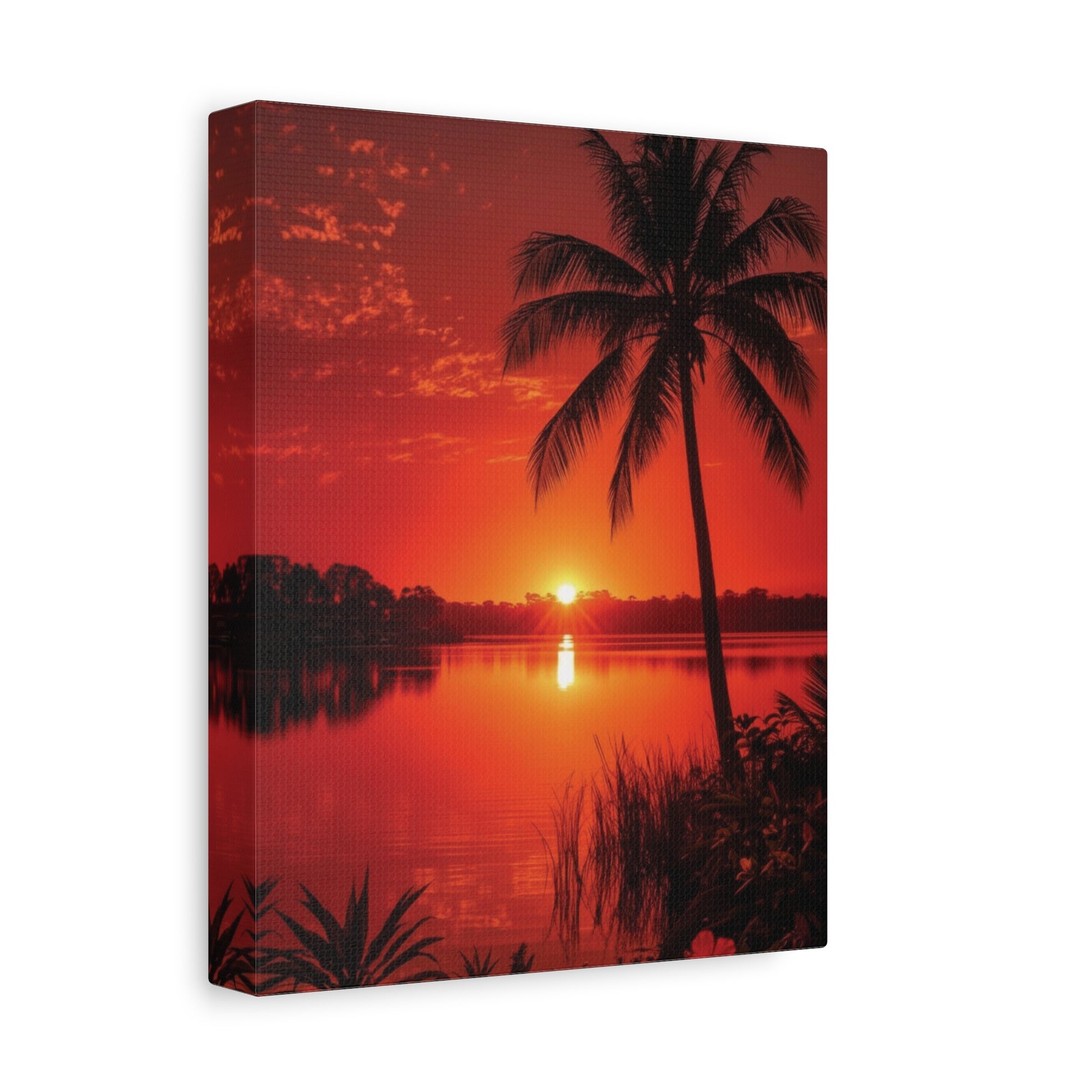 Canvas print of a sunset with palm trees and a lake